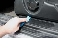 Use a damp shop towel to gently work all the grime and dust away from the plastics