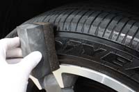 Work the gel into the tyre sidewall avoiding the tread. Note the latex gloves