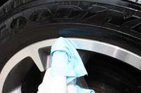 Use a shop towel to wipe any excess off the wheel rim