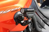 Suction mount on the side of a motorbike.